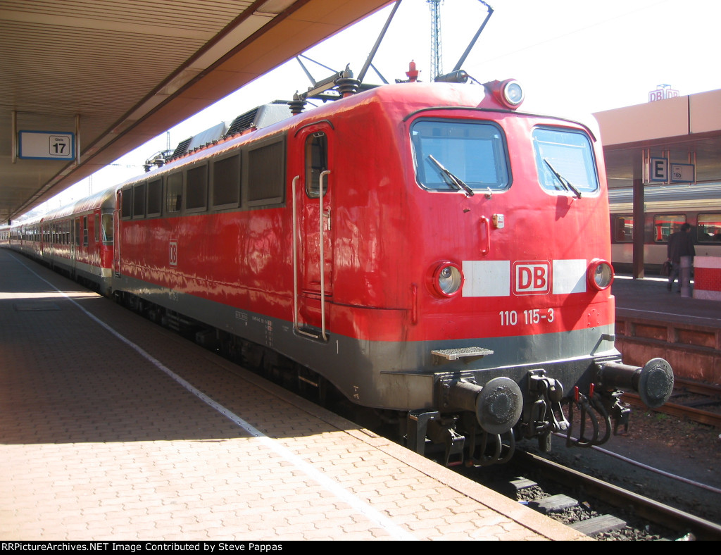 DB 110 115-3 pulled a train into Saarbrucken Hauptbahnhof